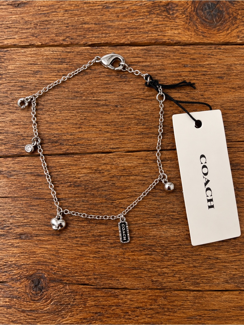 COACH Silver-tone Charm Bracelet with Logo Tag